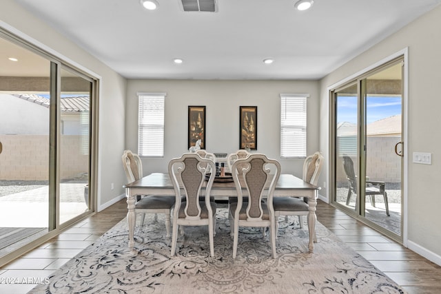 dining space featuring light wood-type flooring