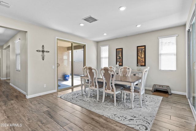 dining area with hardwood / wood-style floors