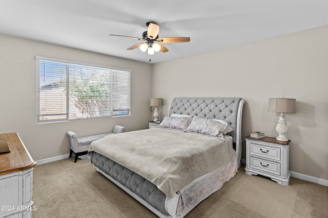 bedroom featuring light colored carpet and ceiling fan