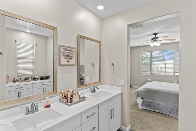 bathroom featuring ceiling fan and vanity