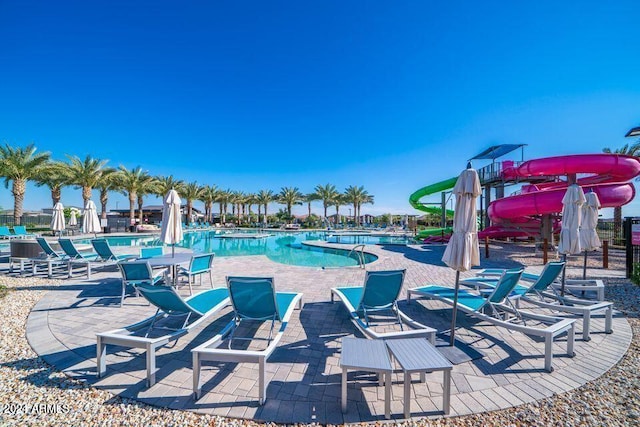 view of swimming pool featuring a patio area