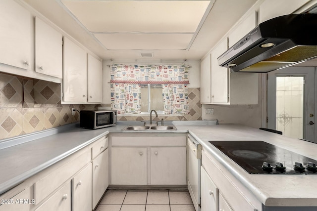 kitchen with sink, white cabinetry, range hood, white dishwasher, and black electric stovetop