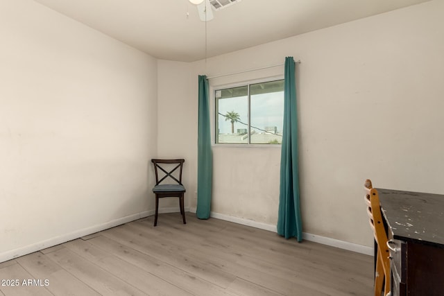 empty room with light hardwood / wood-style flooring