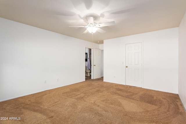 interior space with ceiling fan and carpet floors