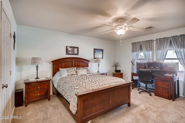 bedroom with ceiling fan and light colored carpet