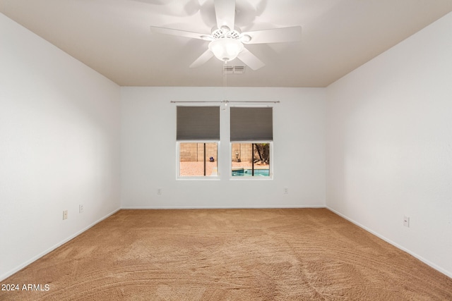 carpeted empty room with ceiling fan