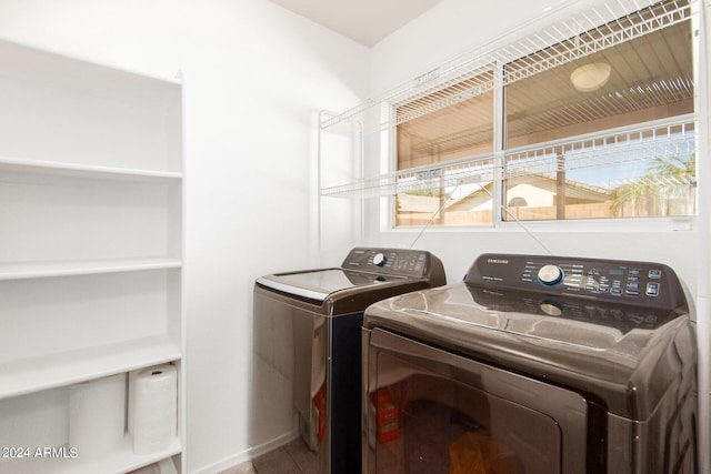 clothes washing area featuring washer and dryer