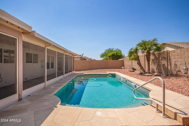 view of swimming pool with a patio