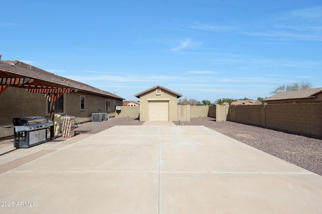 view of patio with concrete driveway, central AC unit, a grill, a pergola, and a fenced backyard