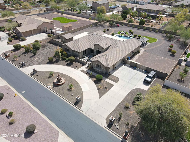 birds eye view of property with a residential view