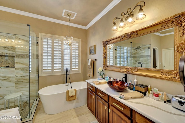 bathroom featuring a stall shower, a freestanding tub, vanity, and crown molding