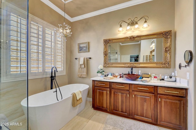 bathroom featuring a soaking tub, crown molding, vanity, and an inviting chandelier