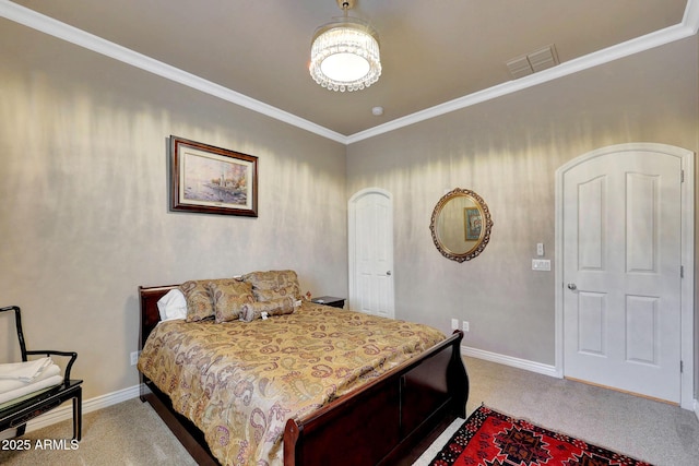 bedroom with ornamental molding, carpet, visible vents, and baseboards