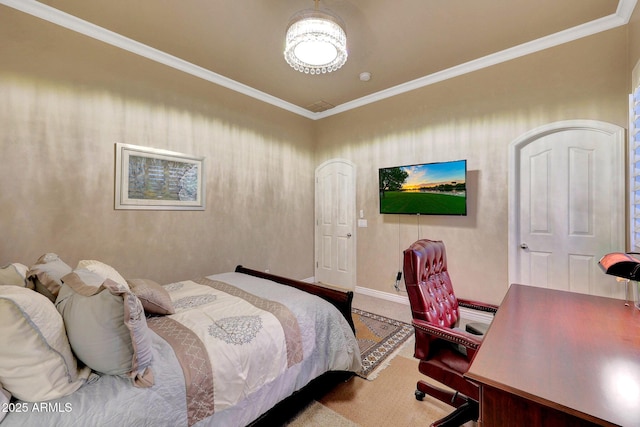 carpeted bedroom featuring baseboards and crown molding