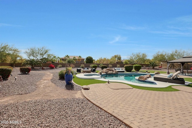 view of pool featuring a fenced backyard, an in ground hot tub, a gazebo, a fenced in pool, and a patio area