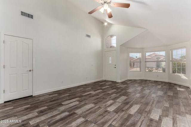 unfurnished living room with high vaulted ceiling, dark wood-type flooring, ceiling fan, and baseboards