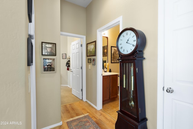 hall with light hardwood / wood-style flooring