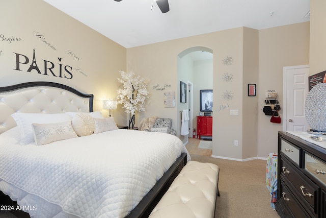 bedroom featuring light carpet and ceiling fan