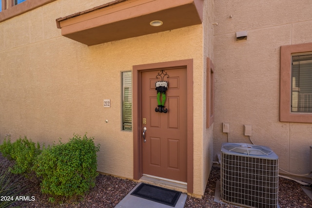 view of exterior entry featuring cooling unit