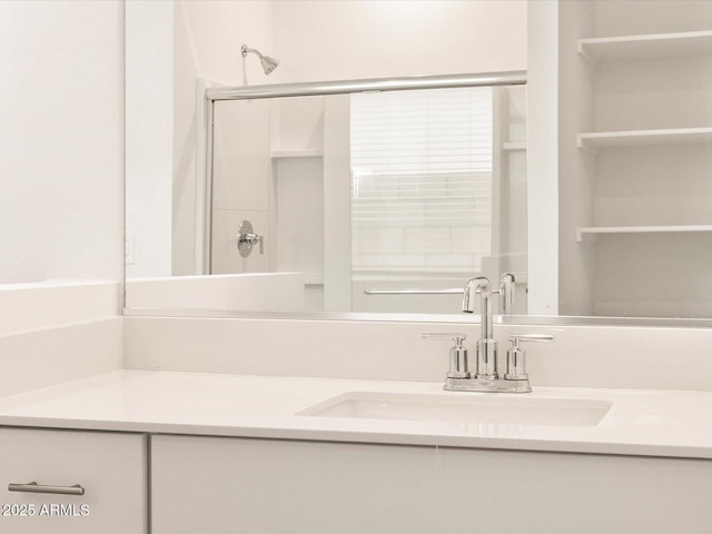 bathroom featuring vanity and a shower stall