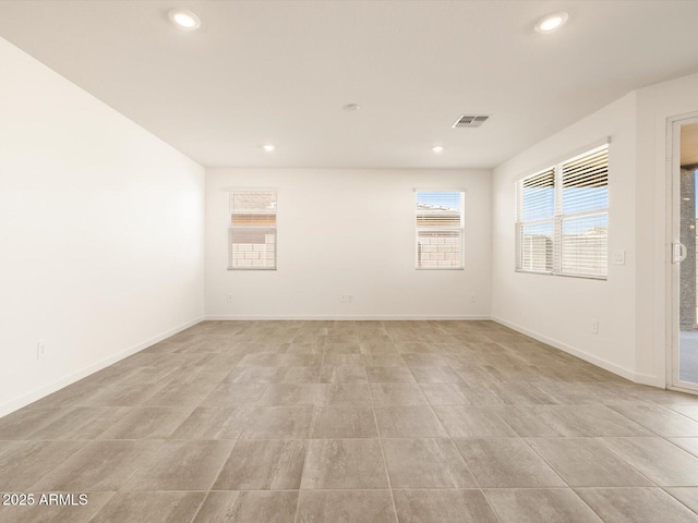 unfurnished room with visible vents, recessed lighting, and baseboards