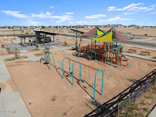 view of jungle gym featuring a mountain view