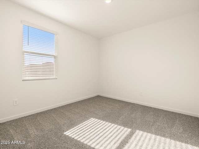 carpeted empty room with baseboards and recessed lighting