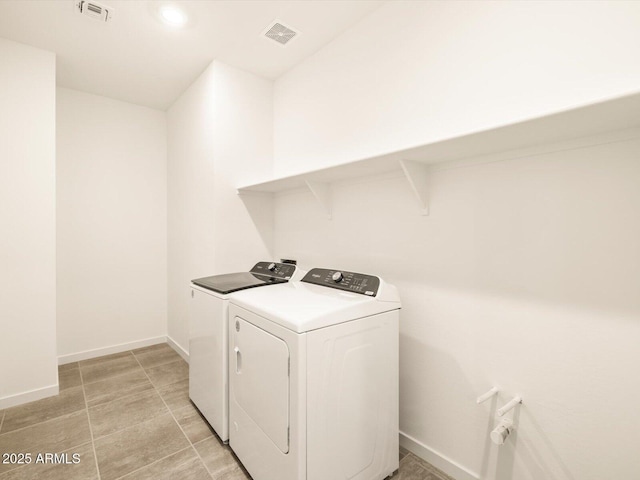 laundry room with independent washer and dryer