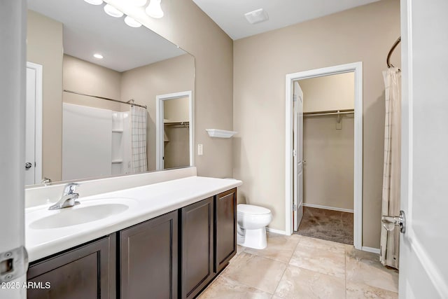 bathroom with vanity, toilet, and curtained shower