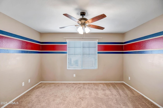 unfurnished room featuring ceiling fan and carpet