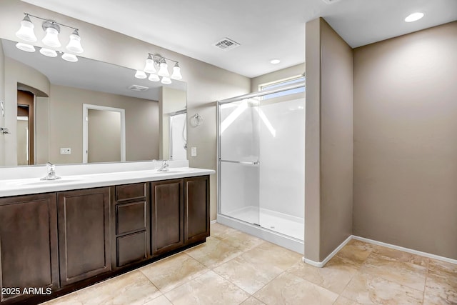 bathroom featuring vanity and a shower with shower door