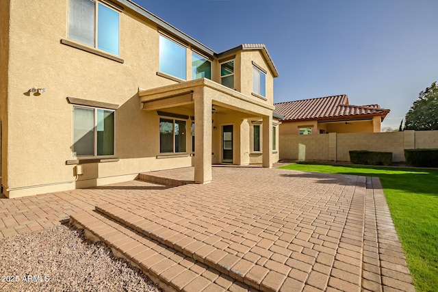 rear view of house with a patio