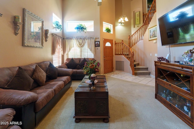 111 N Soho Pl, Chandler, AZ 85225 - living room with stairs, a high ceiling, carpet, a chandelier, and tile patterned floors