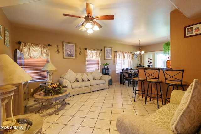 111 N Soho Pl, Chandler, AZ 85225 - living room with light tile patterned floors, a ceiling fan, and a chandelier