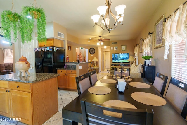 111 N Soho Pl, Chandler, AZ 85225 - dining space featuring light tile patterned floors, a ceiling fan, and a chandelier