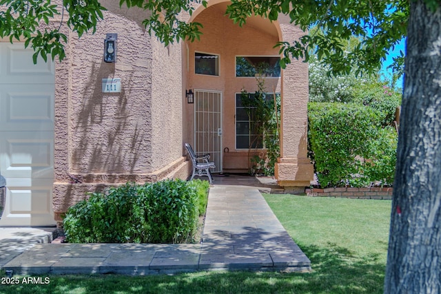 111 N Soho Pl, Chandler, AZ 85225 - property entrance featuring stucco siding and a lawn