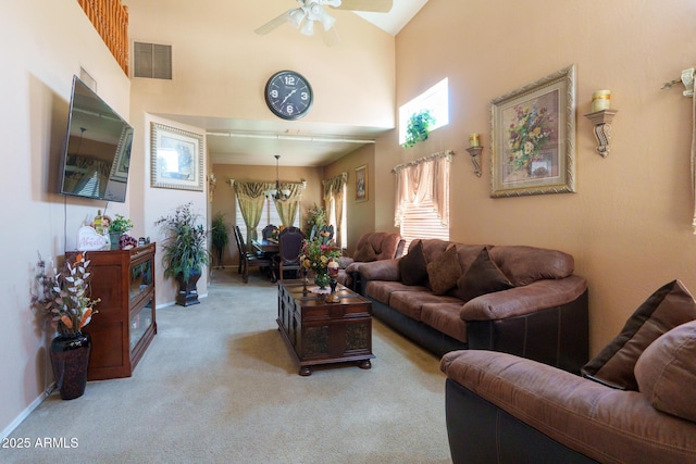 111 N Soho Pl, Chandler, AZ 85225 - living area with carpet floors, a chandelier, a ceiling fan, and a high ceiling