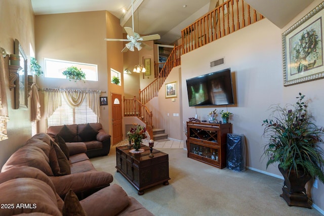 111 N Soho Pl, Chandler, AZ 85225 - living room with a towering ceiling, light colored carpet, stairway, and a ceiling fan