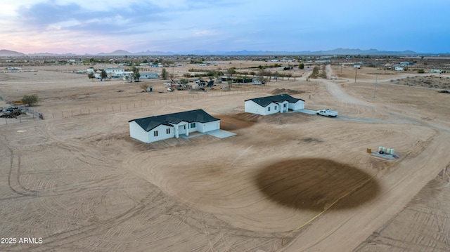 drone / aerial view featuring a rural view and a mountain view