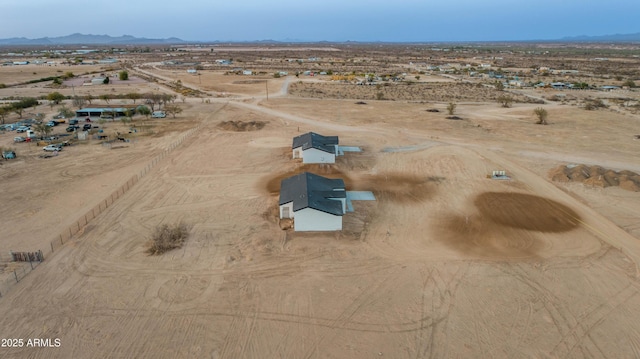 birds eye view of property featuring a mountain view