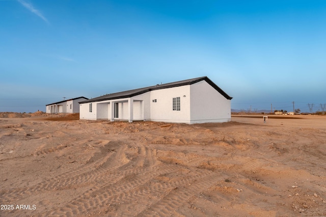 exterior space with stucco siding