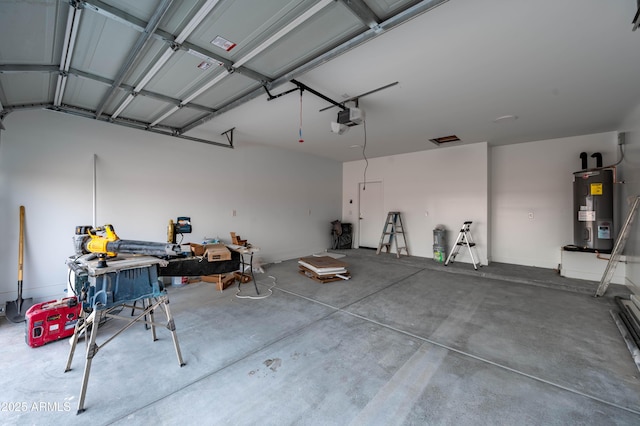 garage with electric water heater and a garage door opener