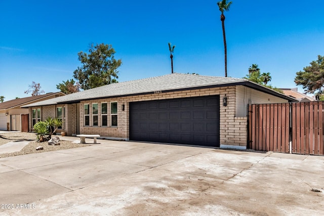 2062 S Emerson, Mesa, AZ 85210 - view of front facade featuring an attached garage, driveway, and brick siding