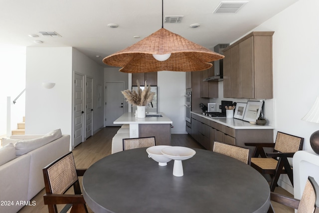 dining area with light hardwood / wood-style floors