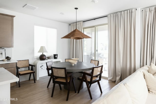 dining area featuring hardwood / wood-style floors