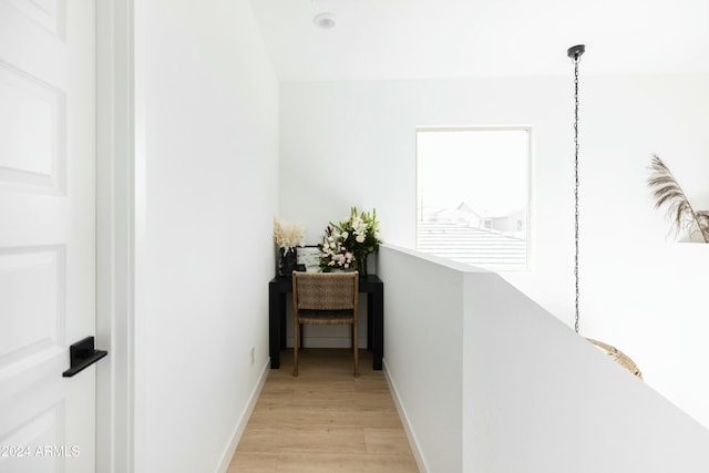 hallway with light wood-type flooring