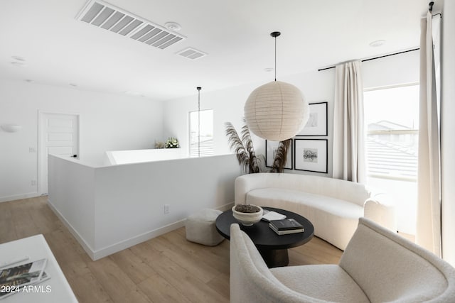 sitting room with light hardwood / wood-style flooring