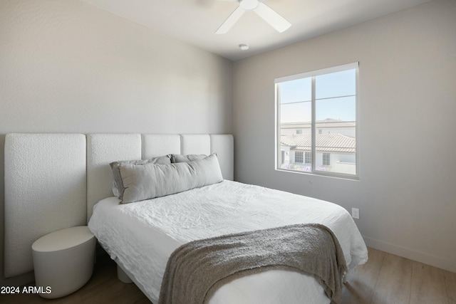 bedroom featuring ceiling fan and wood-type flooring