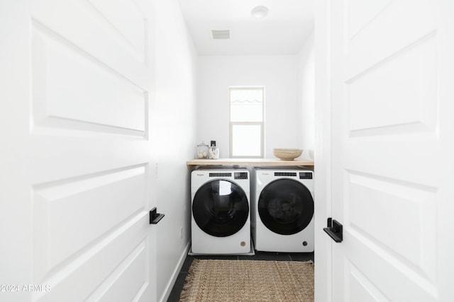 clothes washing area featuring washing machine and clothes dryer