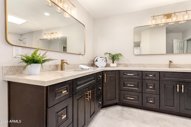 bathroom with tile patterned flooring and vanity